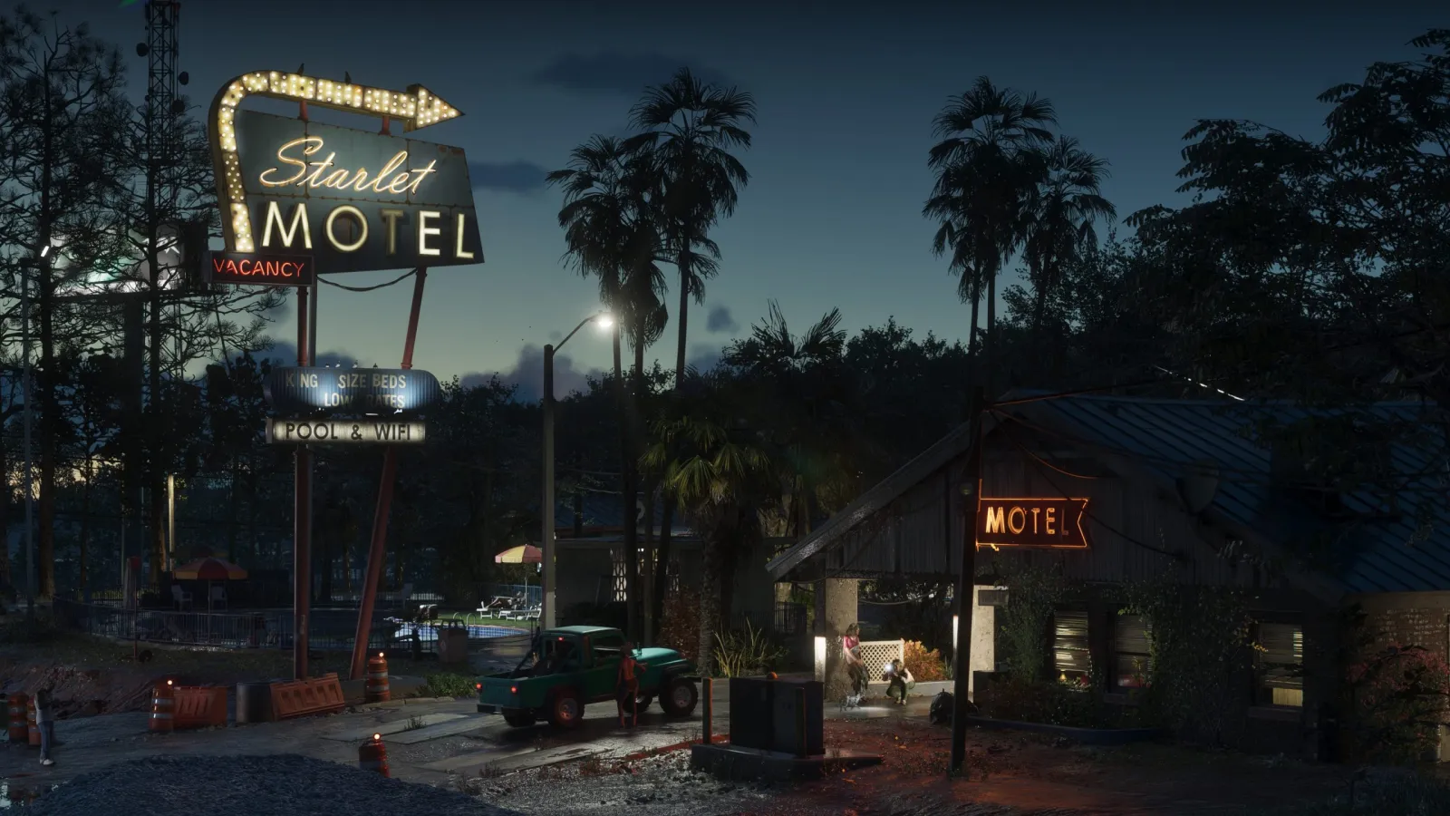 The retro neon sign of the Starlet Motel glowing at dusk in GTA 6's Port Gellhorn, with palms and a pickup truck