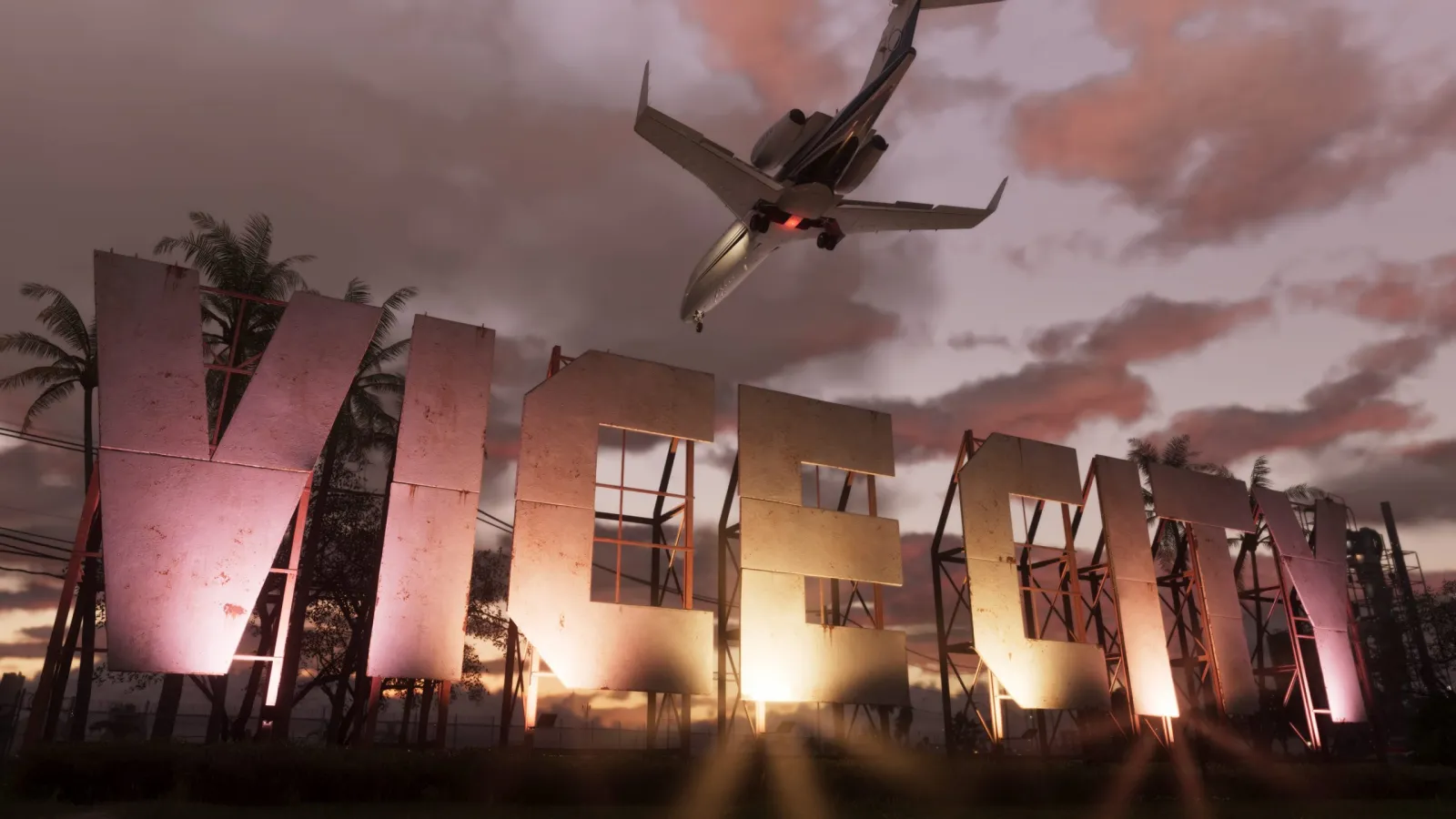 The giant "VICE CITY" sign lit up at sunset in GTA 6, with a jet passing low overhead